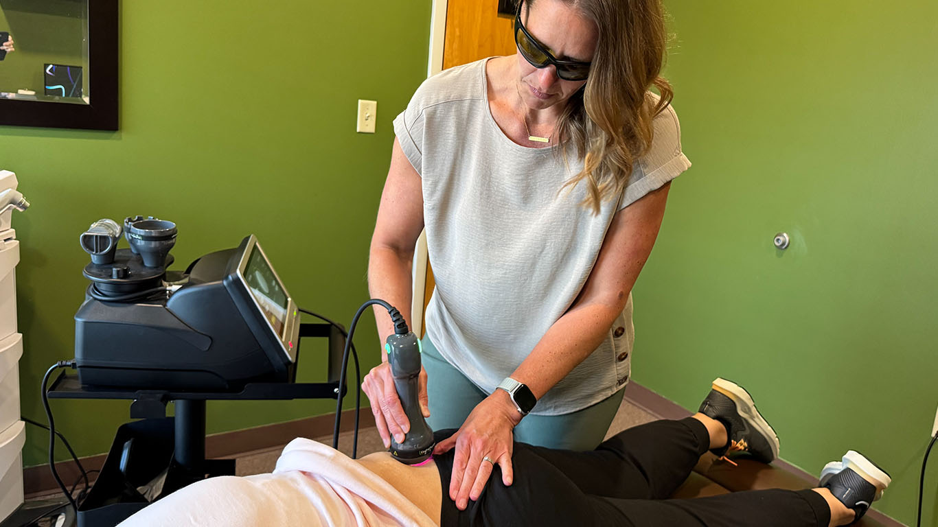 Dr Zock of Zock Family Chiropractic Cranberry Twp, PA, performing laser treatment
